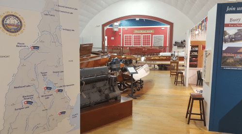 Interior of a museum featuring a map and vintage boats, with displays and artifacts related to boating history.
