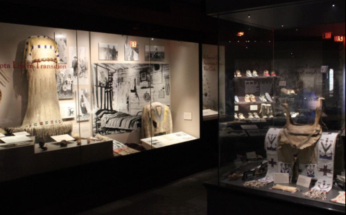 Exhibit showcasing historical artifacts and images, highlighting cultural transitions and heritage.