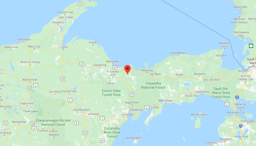 Map showing a location marked with a red pin in the Hiawatha National Forest area of Michigan.