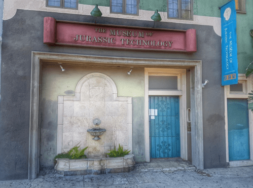 Exterior of the Museum of Jurassic Technology, featuring a decorative entrance and a small fountain.