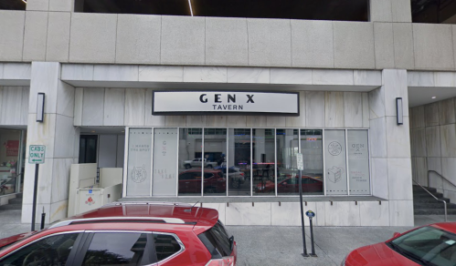 Exterior view of Gen X Tavern, featuring a modern sign and large windows, with parked cars in front.