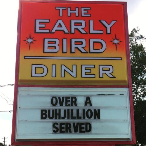 Sign for The Early Bird Diner reads: "Over a Buhjillion Served" in bold letters against a colorful background.