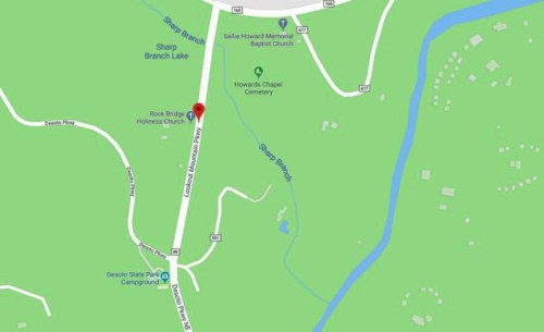 Map showing roads, churches, and Sharp Branch Lake in a green landscape with nearby camping areas.