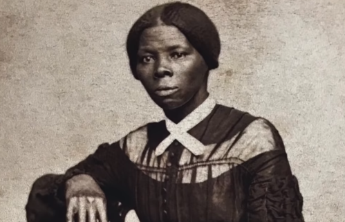 A historical portrait of a Black woman in 19th-century attire, seated with a serious expression.