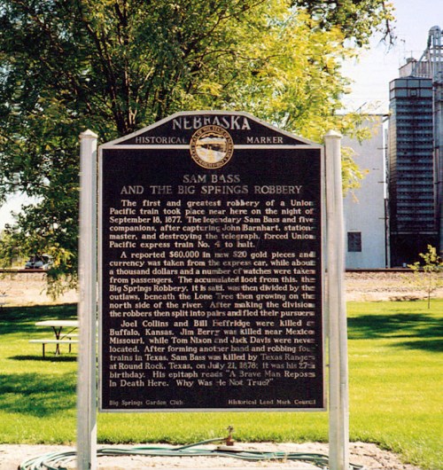 Historical marker detailing the Sam Bass and Big Springs robbery in Nebraska, highlighting events from September 10, 1877.