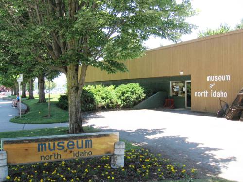 Exterior view of the Museum of North Idaho, featuring a wooden facade and landscaped surroundings.