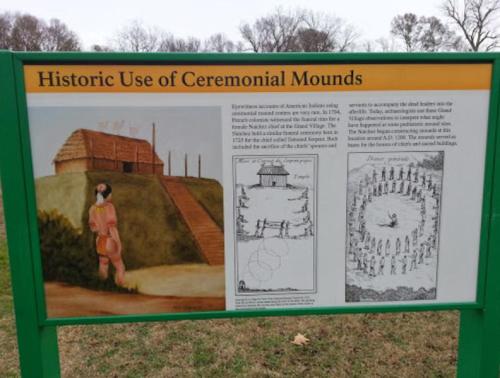 Sign about historic use of ceremonial mounds, featuring illustrations and a description of Native American practices.
