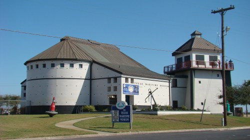 Exterior view of the Texas Maritime Museum, featuring a unique architectural design and a lighthouse-like structure.