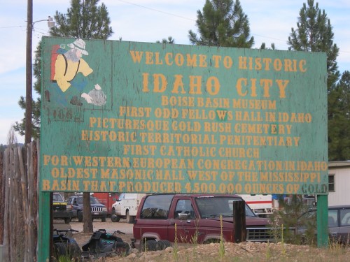 Sign welcoming visitors to historic Idaho City, listing local attractions and historical sites.