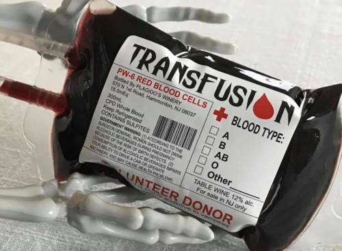 A blood bag labeled "Transfusion" with a skeleton hand underneath, indicating blood type options.
