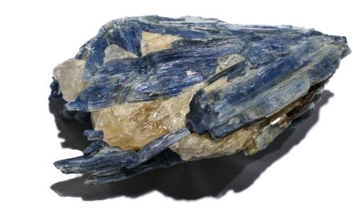 A cluster of blue kyanite crystals with some clear quartz, showcasing sharp, elongated formations.