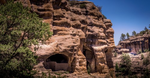 Distant view of ancient village ruins at Gila National Forest, a historic attraction in New Mexico.