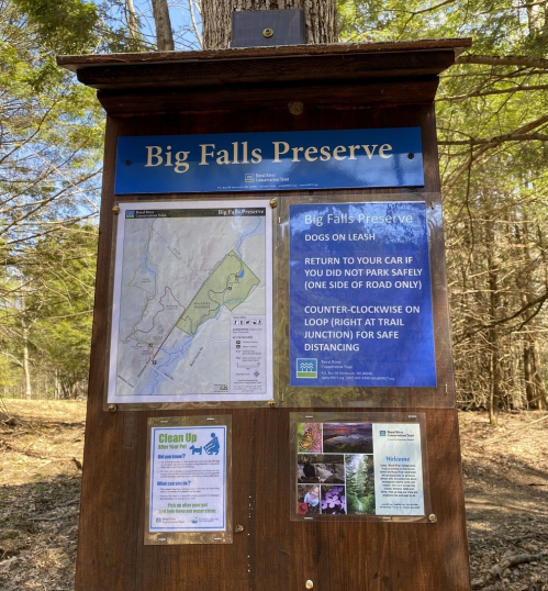 Sign at Big Falls Preserve with park rules, map, and safety guidelines for visitors.
