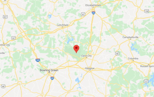 Map showing a location marked with a red pin near Cave City, Kentucky, surrounded by green areas and roads.