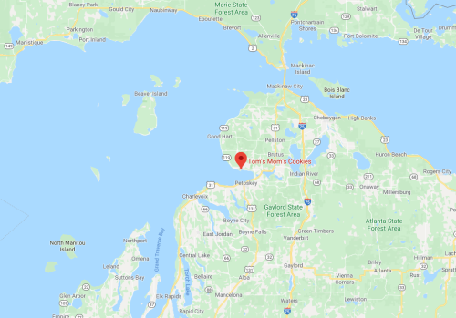 Map showing the location of Tom's Mom's Cookies near Petoskey, Michigan, surrounded by lakes and forests.