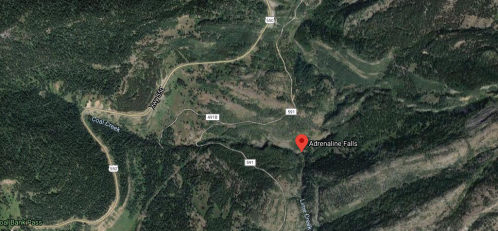 Map showing the location of Adrenaline Falls, surrounded by green hills and roads in a mountainous area.