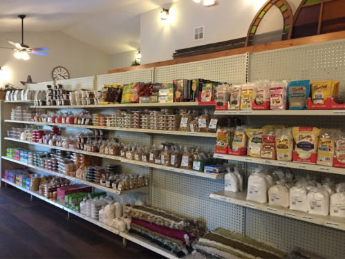 A well-organized store shelf filled with various packaged foods, snacks, and baking supplies.
