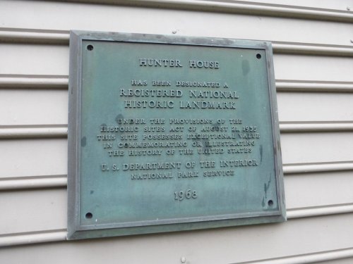 Plaque on a building designating it as a registered national historic landmark, dated 1968.