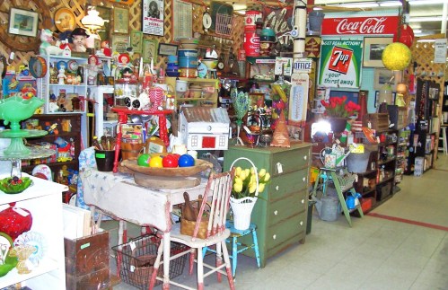 A vibrant antique shop filled with colorful decor, vintage items, and eclectic collectibles on display.
