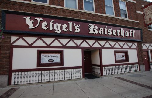 Exterior of Veigel's Kaiserhoff restaurant, featuring a brick facade and decorative signage.