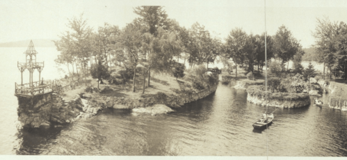 A vintage photo of a serene island with trees, a gazebo, and a small boat on calm waters.