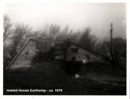 Black and white photo of a Hobbit House Earthship from around 1979, featuring a unique, earth-sheltered design.