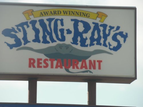 Sign for "Sting Ray's Restaurant," featuring an award-winning logo with a stingray graphic.