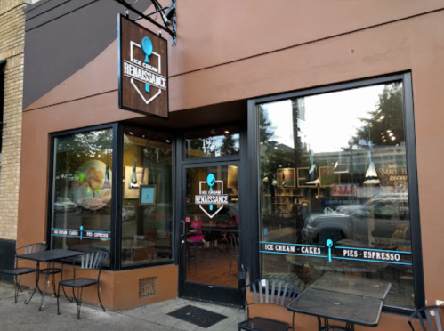 Exterior of an ice cream shop named "Renaissance," featuring large windows and outdoor seating.