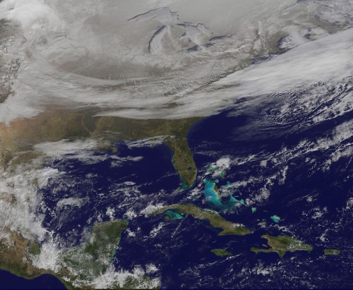 Satellite image showing the southeastern United States, with clouds over land and clear waters in the Gulf of Mexico.