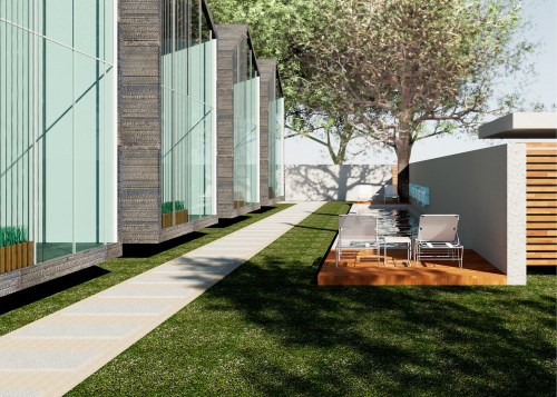Modern outdoor space featuring glass-walled buildings, a pathway, and a wooden deck with lounge chairs by a pool.