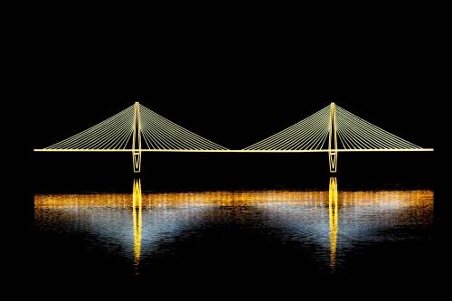 A brightly lit suspension bridge reflected in dark water at night, showcasing its elegant design and illumination.