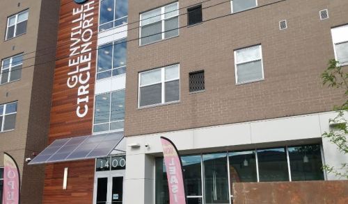 Exterior view of Glenville Circle North building, featuring large windows and a modern design.