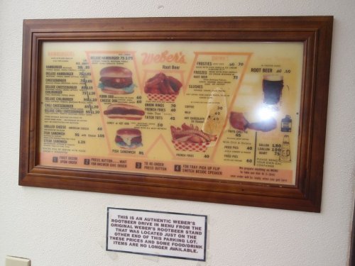 Framed menu of Weber's featuring burgers, drinks, and sides, with a note about item availability.