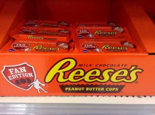 Display of Reese's Peanut Butter Cups in a bright orange box labeled "Fan Edition" with basketball images.