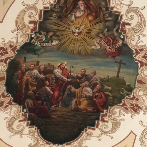 A religious mural depicting Jesus with disciples, surrounded by angels and symbols of faith, set in an ornate frame.