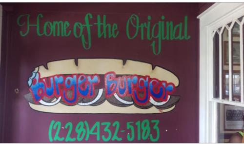 Sign reading "Home of the Original Burger Burger" with a colorful illustration of a burger and contact number.