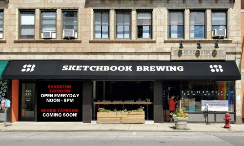 Exterior of Sketchbook Brewing with a sign announcing the Evanston taproom hours and a Skokie taproom opening soon.