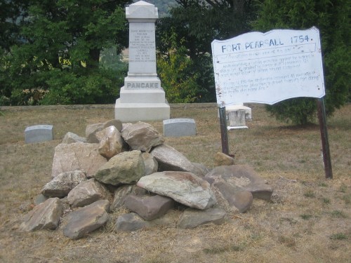 A pile of rocks near a historical marker and monument for Fort Pearsall, established in 1754.