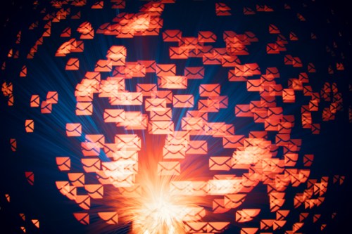 Abstract image of glowing envelopes radiating outward, creating a dynamic, energetic visual effect.