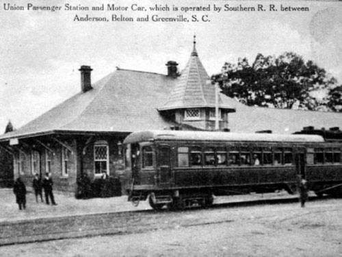 Historic Union Passenger Station with a motor car, featuring a distinctive architectural design, in South Carolina.