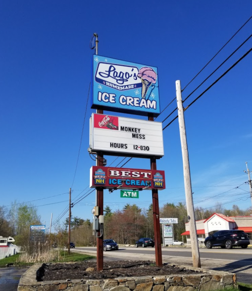 Sign for Lago's Homemade Ice Cream featuring "Monkey Mess" flavor and hours from 12 to 8:30 PM.