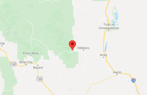 Map showing Hillsboro, New Mexico, marked with a red pin, surrounded by green areas and nearby towns.