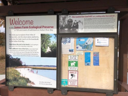 Signboard at James Farm Ecological Preserve, detailing trails, wildlife, and conservation efforts in Indian River Bay.