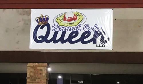 A sign for "Funnel Cake Queen, LLC" featuring a crown and a funnel cake topped with whipped cream and cherries.
