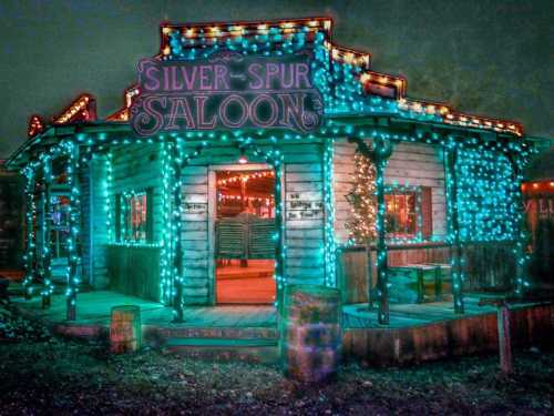 A brightly lit saloon with colorful lights, featuring a sign that reads "Silver Spur Saloon" in a festive atmosphere.