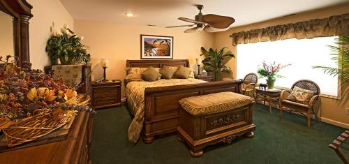 Cozy bedroom with a wooden bed, decorative plants, and a large window, featuring warm colors and elegant furnishings.
