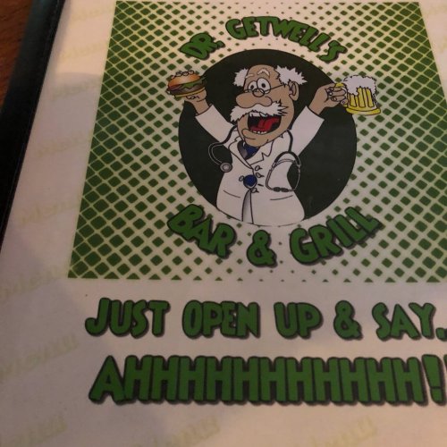 Cartoon doctor holding a burger and beer, with the text "Dr. Getwell's Bar & Grill" and "Just open up & say... AHHHHHHH!"