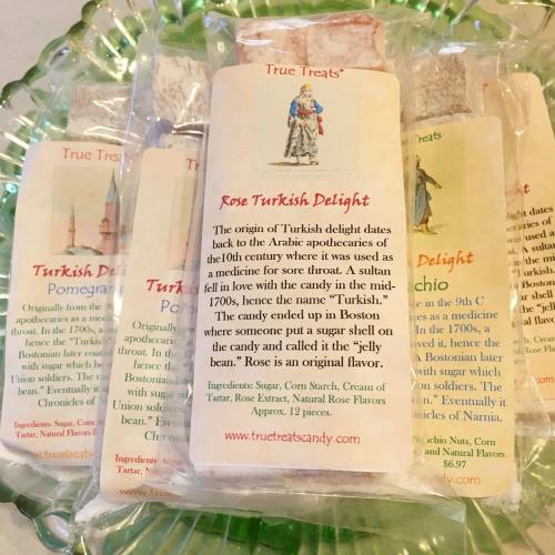 A package of Rose Turkish Delight on a decorative plate, with a brief history and ingredients listed on the wrapper.