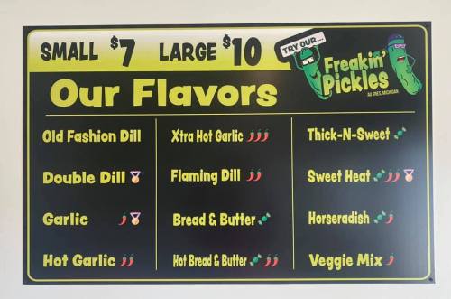Menu board for "Freakin' Pickles" featuring various pickle flavors and prices: Small $7, Large $10.