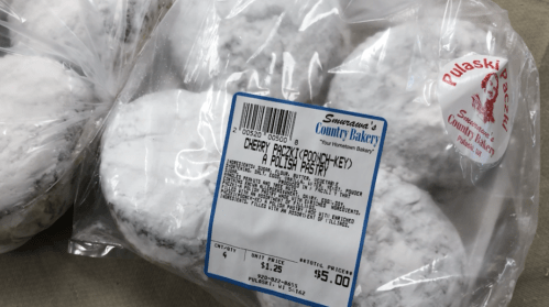 A bag of powdered cherry paczki from Szymanski's Country Bakery, labeled with price and product details.